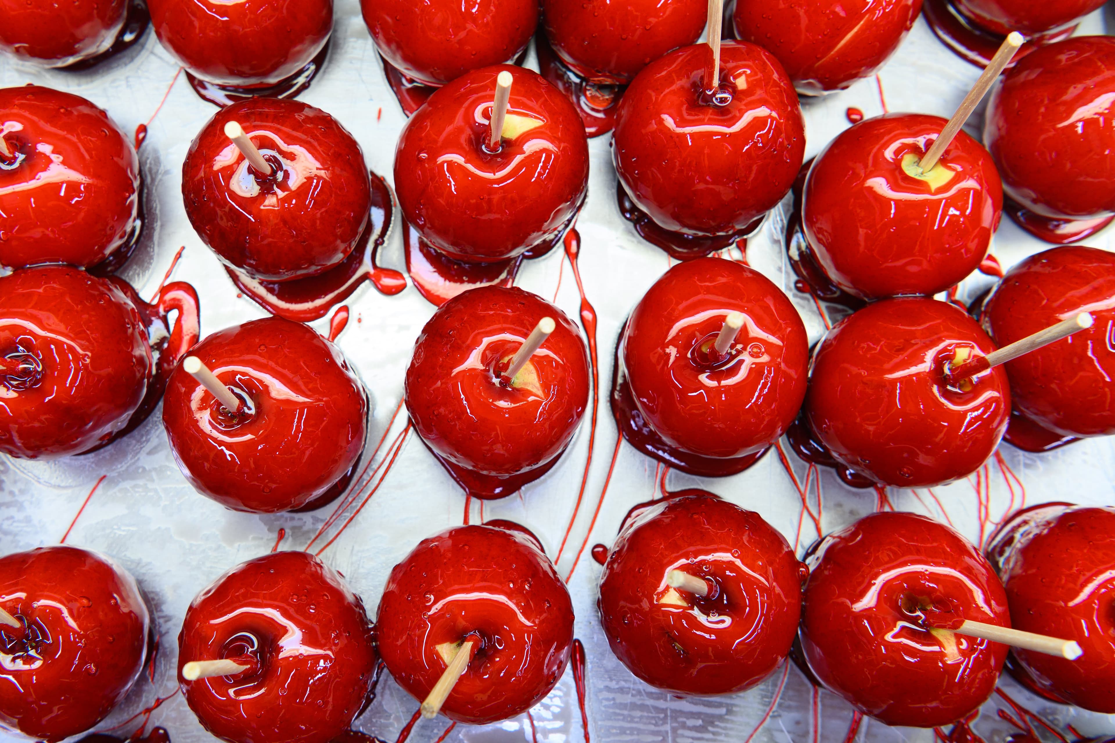 File photo: Red candy-coated apples are displayed on sticks.